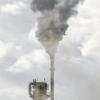 Industrial smokestack and clouds