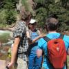 Sarah Spaulding talks with students during a hike to sample diatoms in Rocky Mountain streams.