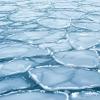 Cracked sea ice floating on water in South Harbour, Helsinki, Finland. Photo: Tapio Haaja on Unsplas