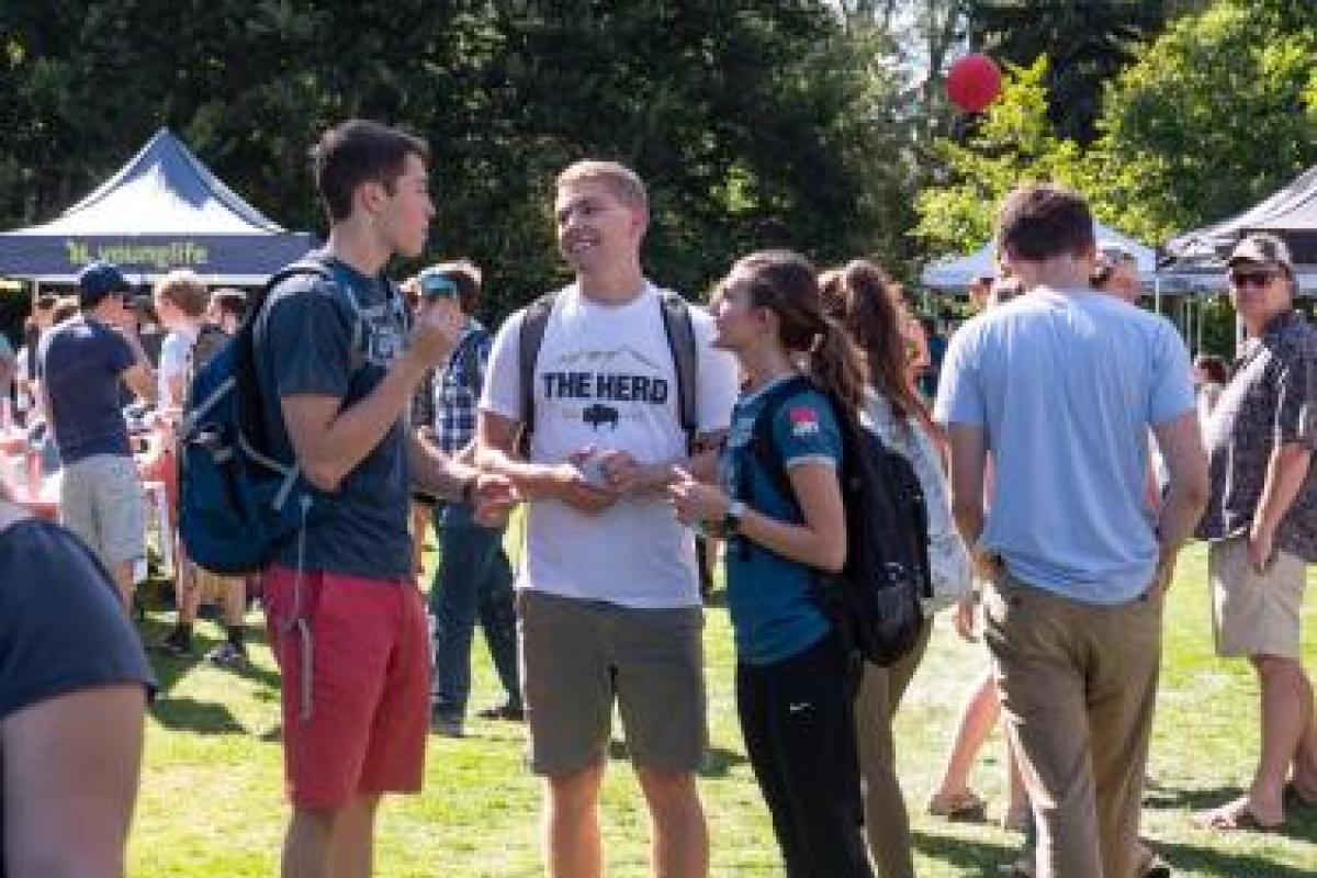 three students at the Be Involved Fair