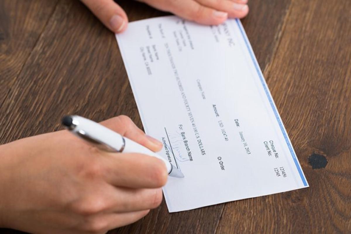 person writing a check
