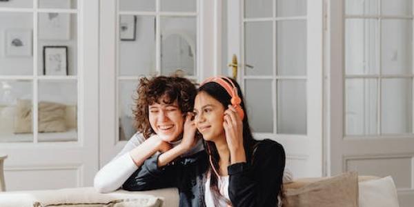 two students listening to music