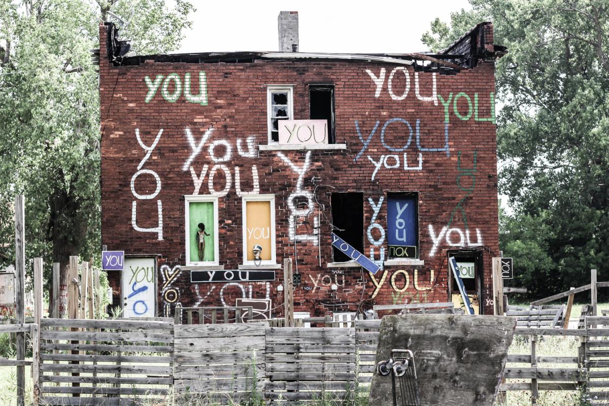 Building in Detroit with "You" Painted on it many times