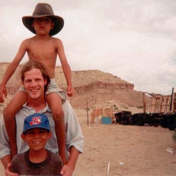 Student carries a child on his shoulders