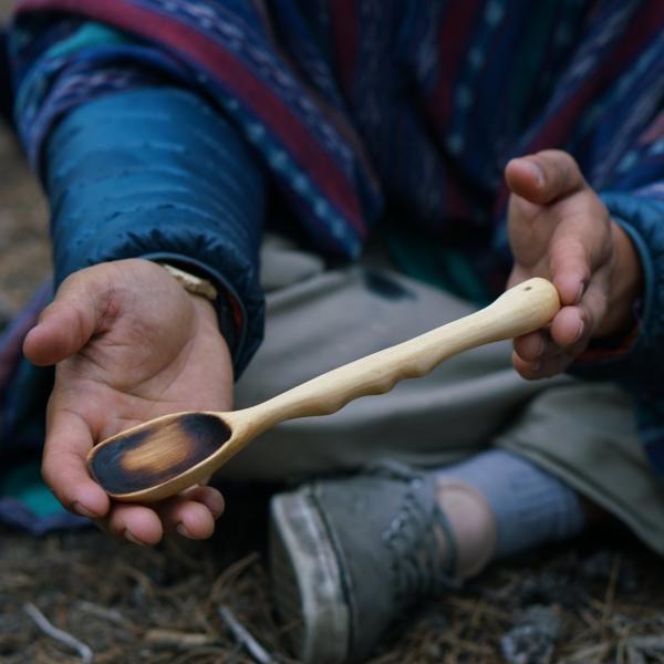 Staff showing homemade wooden spoon