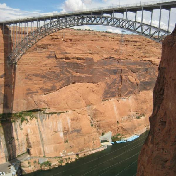 Large bridge spans a red canyon