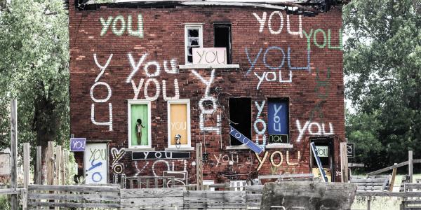 Building in Detroit with "You" Painted on it many times