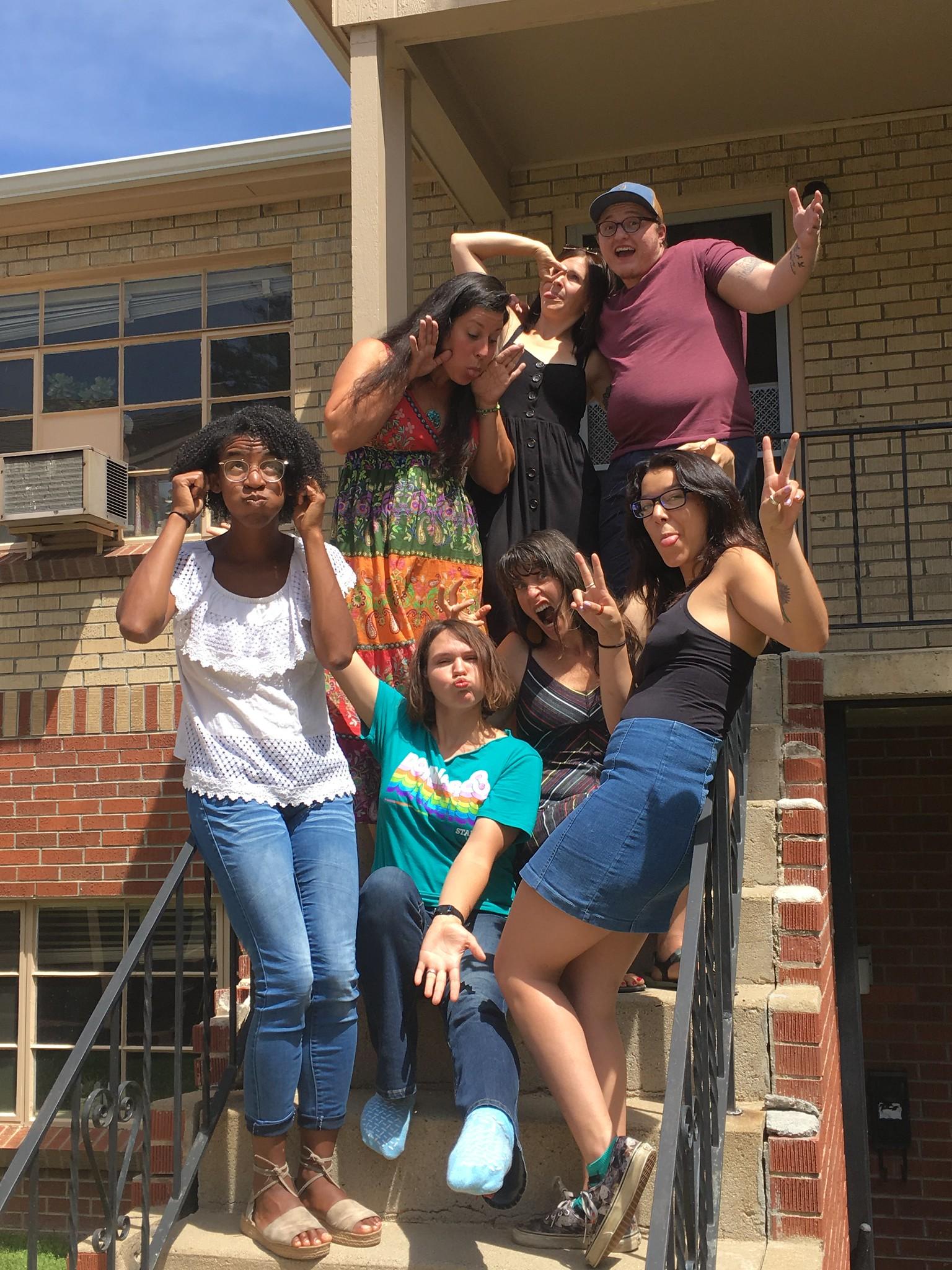 Students and staff on building steps