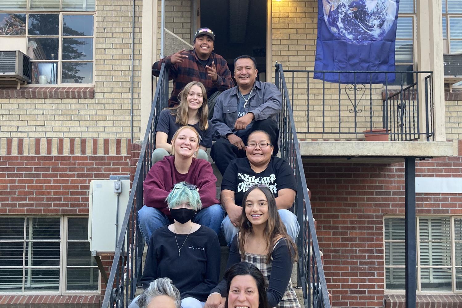 Community partners on steps outside office