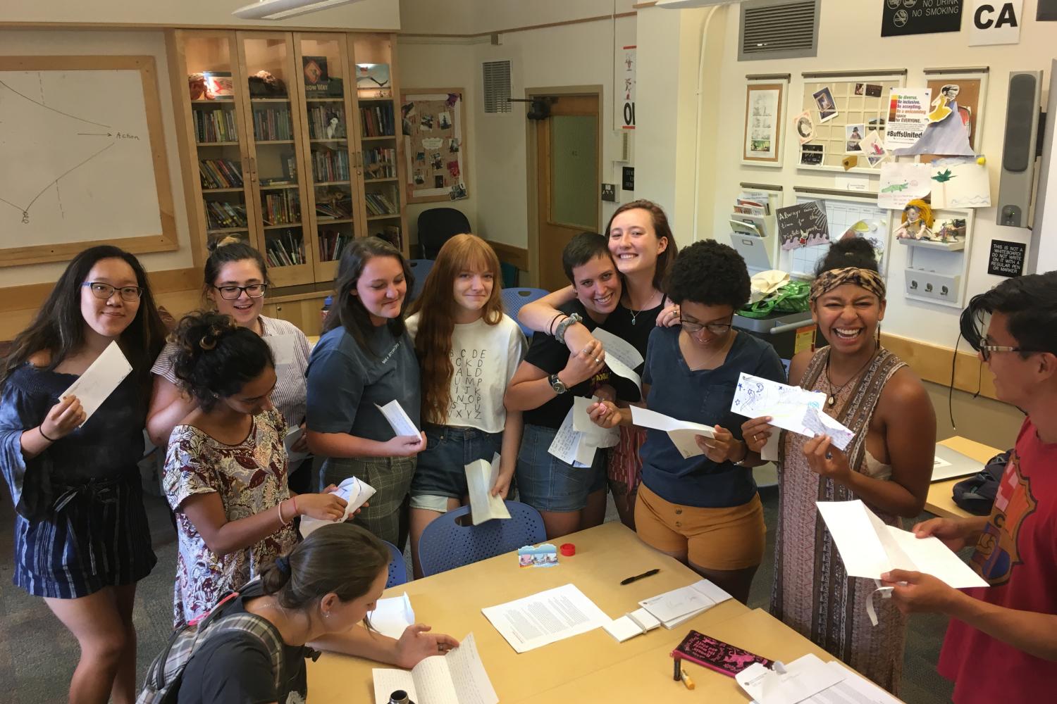 Students in group activity smiling