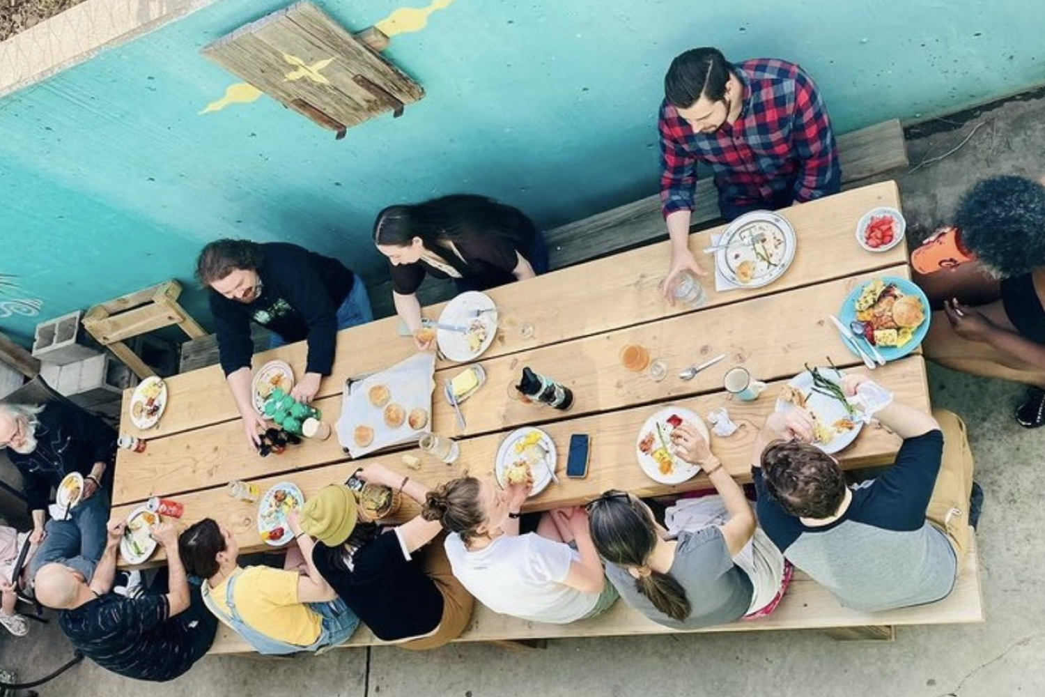 Long table with people eating