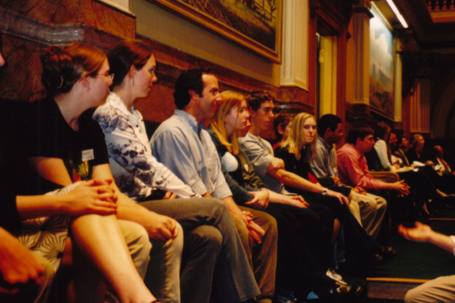 Man speaking to a group of students