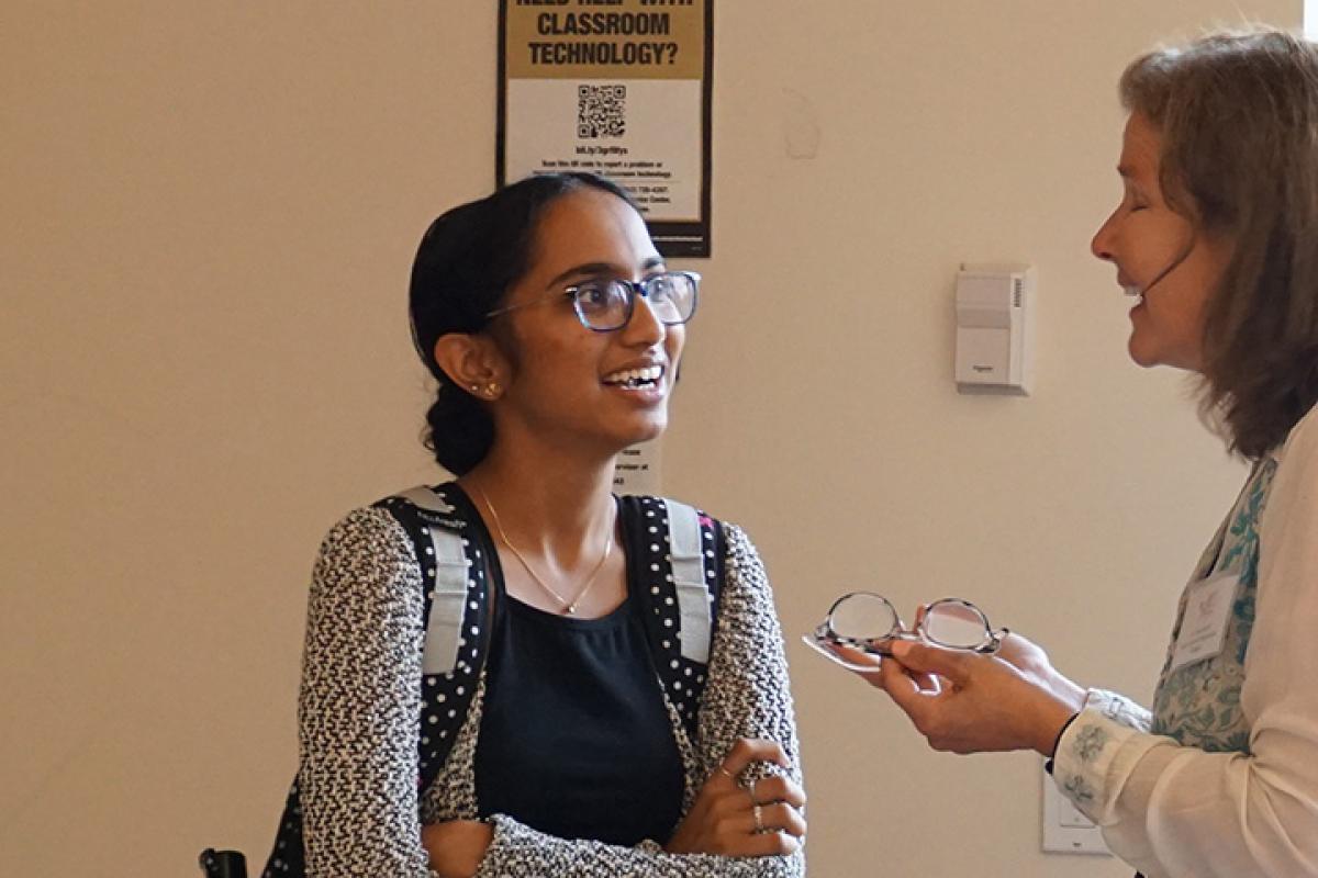 Two women sharing information with each other