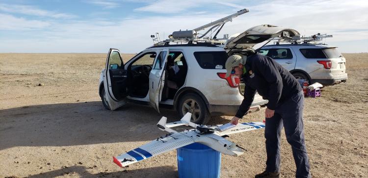 IRISS pilot Michael Rhodes completes preflight checklist for the RAAVEN