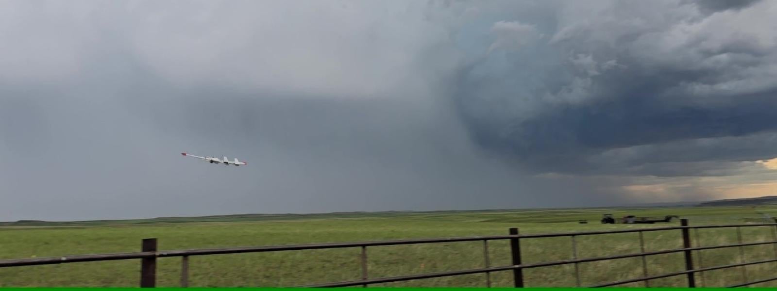 The RAAVEN flies over a field toward the hail core