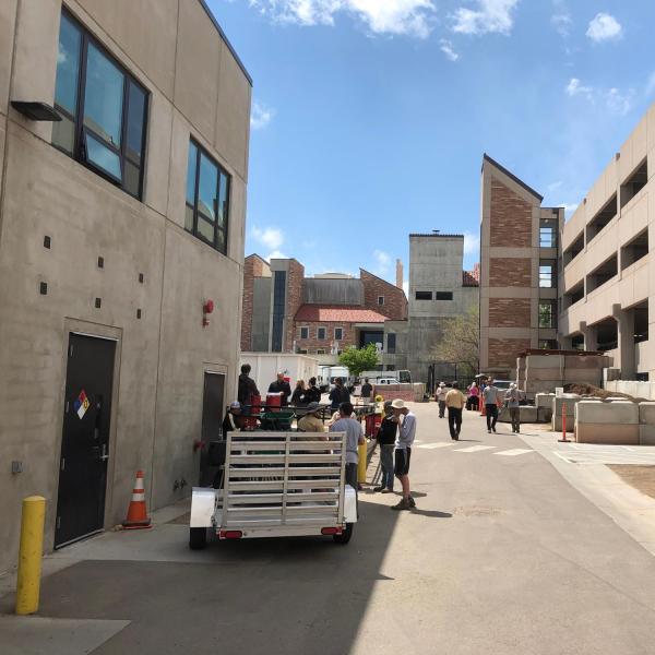 Employees grabbing food outside of the GROC