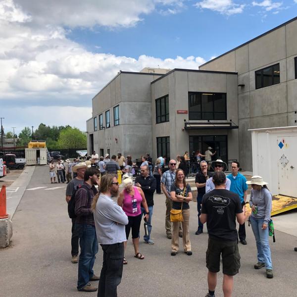 Employees in a circle outside of the GROC beginning a tour