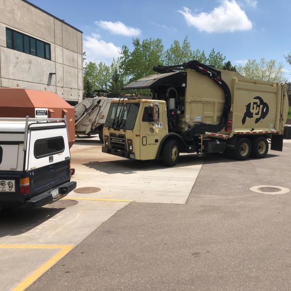 CU garbage truck outside of the GROC
