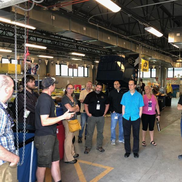 Employees inside of the Recycling center on a tour