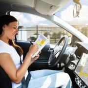 A woman riding in an autonomous car