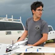 Student in the field with drone