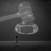 A digital gavel and person  