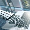 Robot typing on computer 