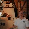 Kirk next to a shuttle craft in a hanger