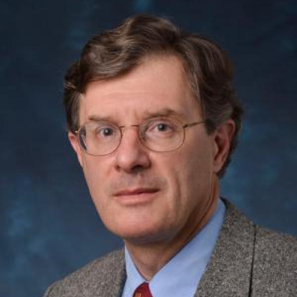 Al Gasiewski portrait on blue background 