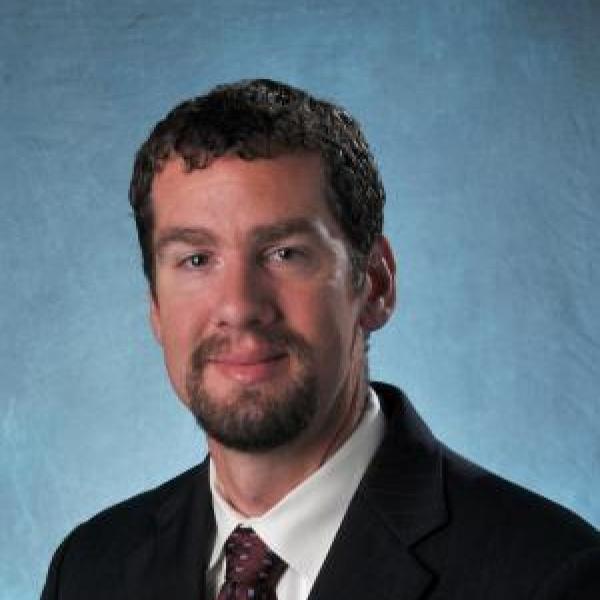 Mark Borden portrait on blue background 
