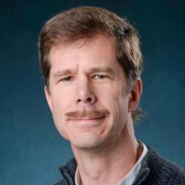 Bob McLeod portrait on blue background 