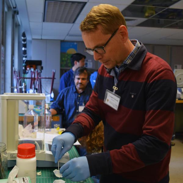 A student working on a machine during the session