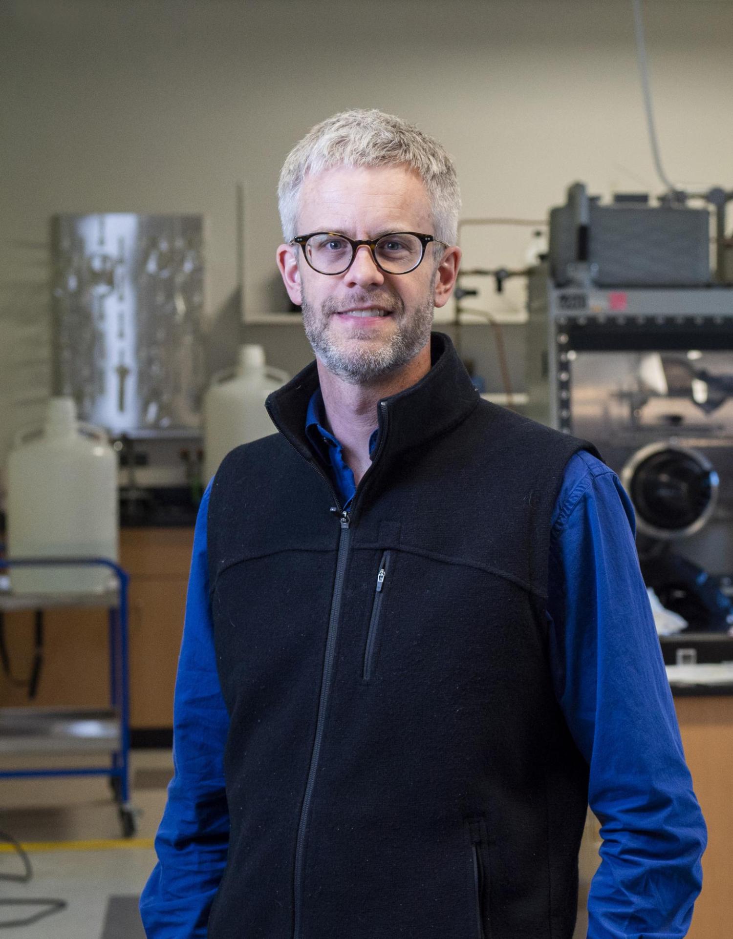 Mike in the lab standing for a portrait