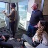 Iain boyd and students drawing diagrams in a group