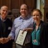 Tim white at the conference with his award 