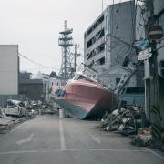 tsunami aftermath boat in road