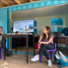 Students holding a talk in the field 