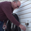 A resident taking a water quality sample