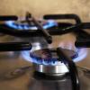 A flame on the top of a stove 