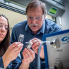 Alan Weimer with a student in his laboratory 