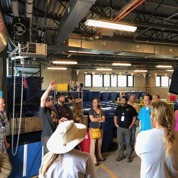 Employees inside of the Recycling center on a tour