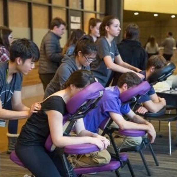 People receiving chair massages