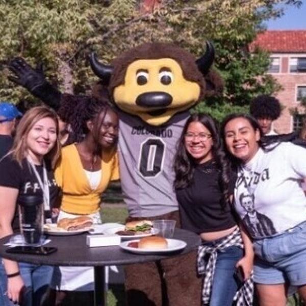 International students posing with Chip