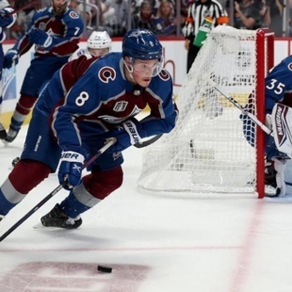 Colorado Avalanche player skating behind goal