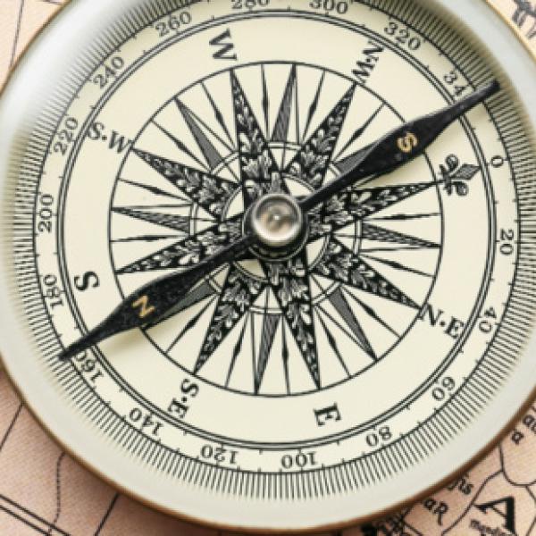 Compass laying on a map