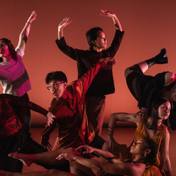 Seven dancers in artistic dance pose