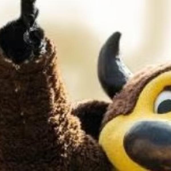 Ralphie with hand up and person next to him