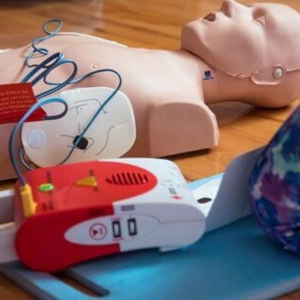 CPR dummy hooked up to defibrillator
