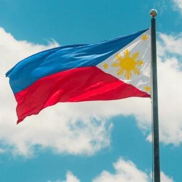 Flag of Philippines with clouds in the background