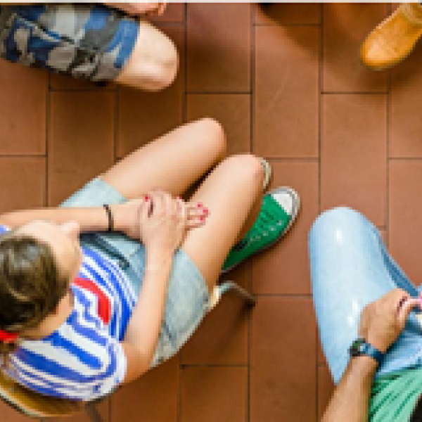 Photo of people sitting in circle taken from above